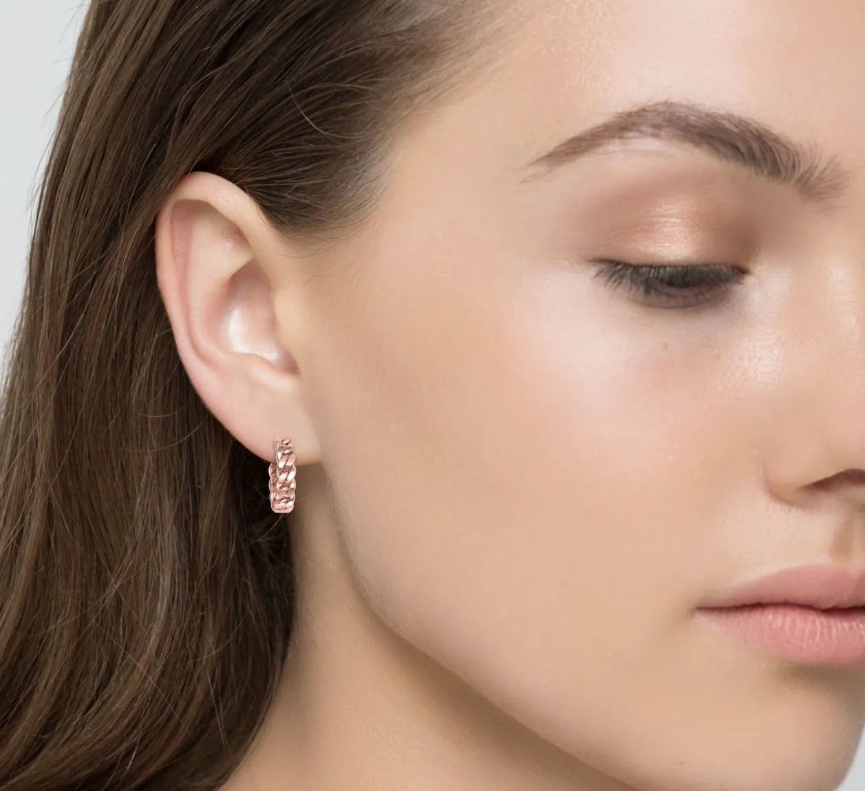 High-polished 20mm hoop earrings with a Cuban link design, symbolizing timeless elegance and sophistication, perfect for any occasion.