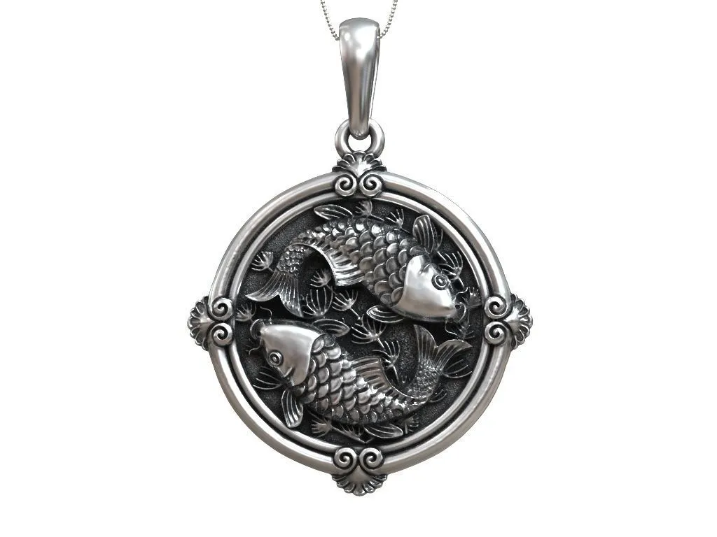 Small round silver pendant featuring elegantly designed koi carp, symbolizing good fortune and grace