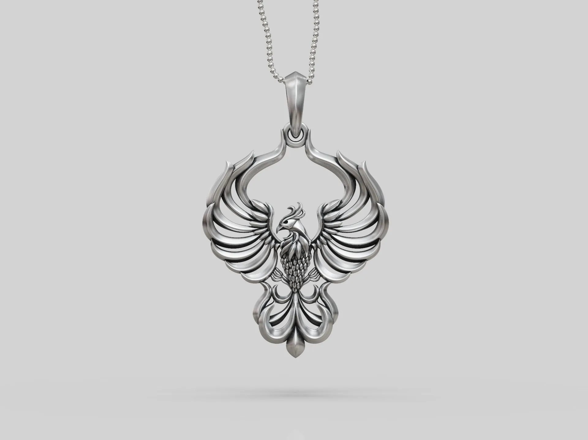 Phoenix Bird Pendant-3 Silver Phoenix Bird Pendant depicting the mythical phoenix in mid-flight, symbolizing rebirth and renewal.