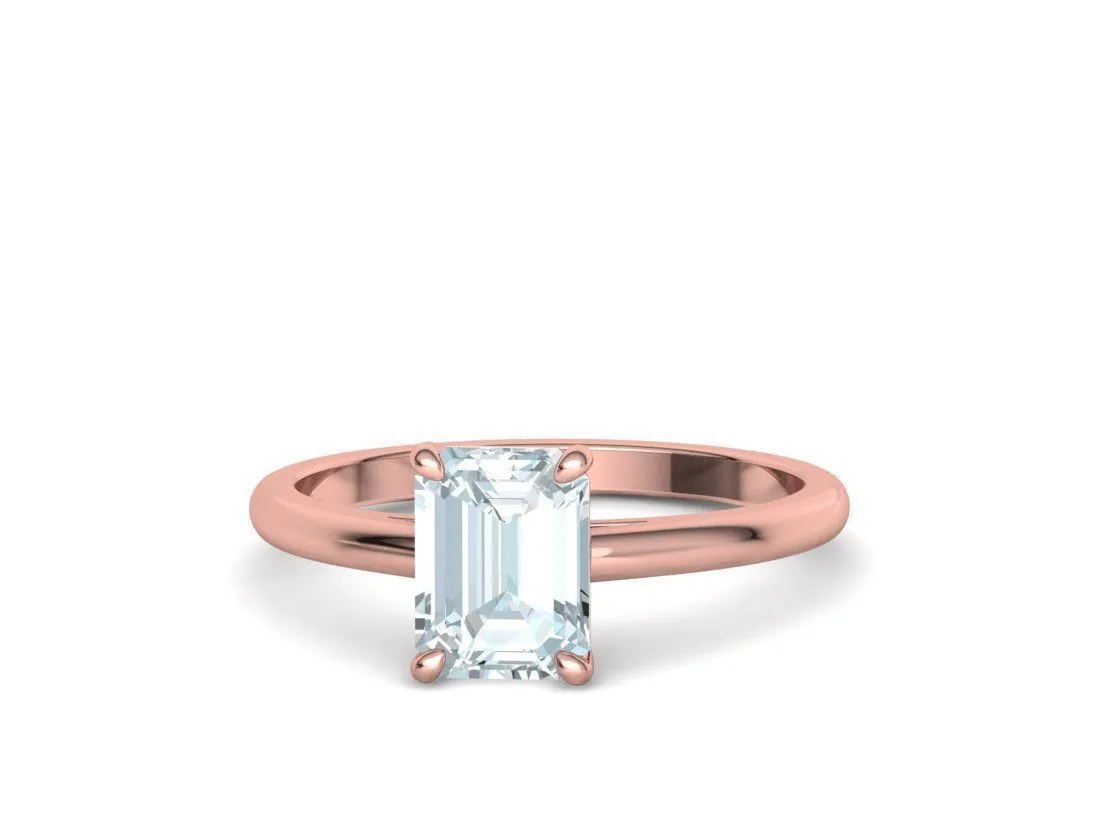 High-polished Emerald Cut Solitaire Ring with an 8x6mm emerald cut solitaire diamond, symbolizing luxury and elegance, perfect for any occasion.