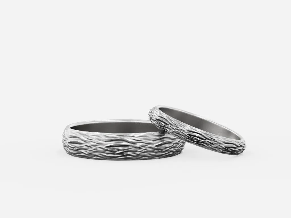 Wedding ring featuring a detailed textured water surface design, symbolizing the ever-changing yet enduring nature of love, perfect for couples.