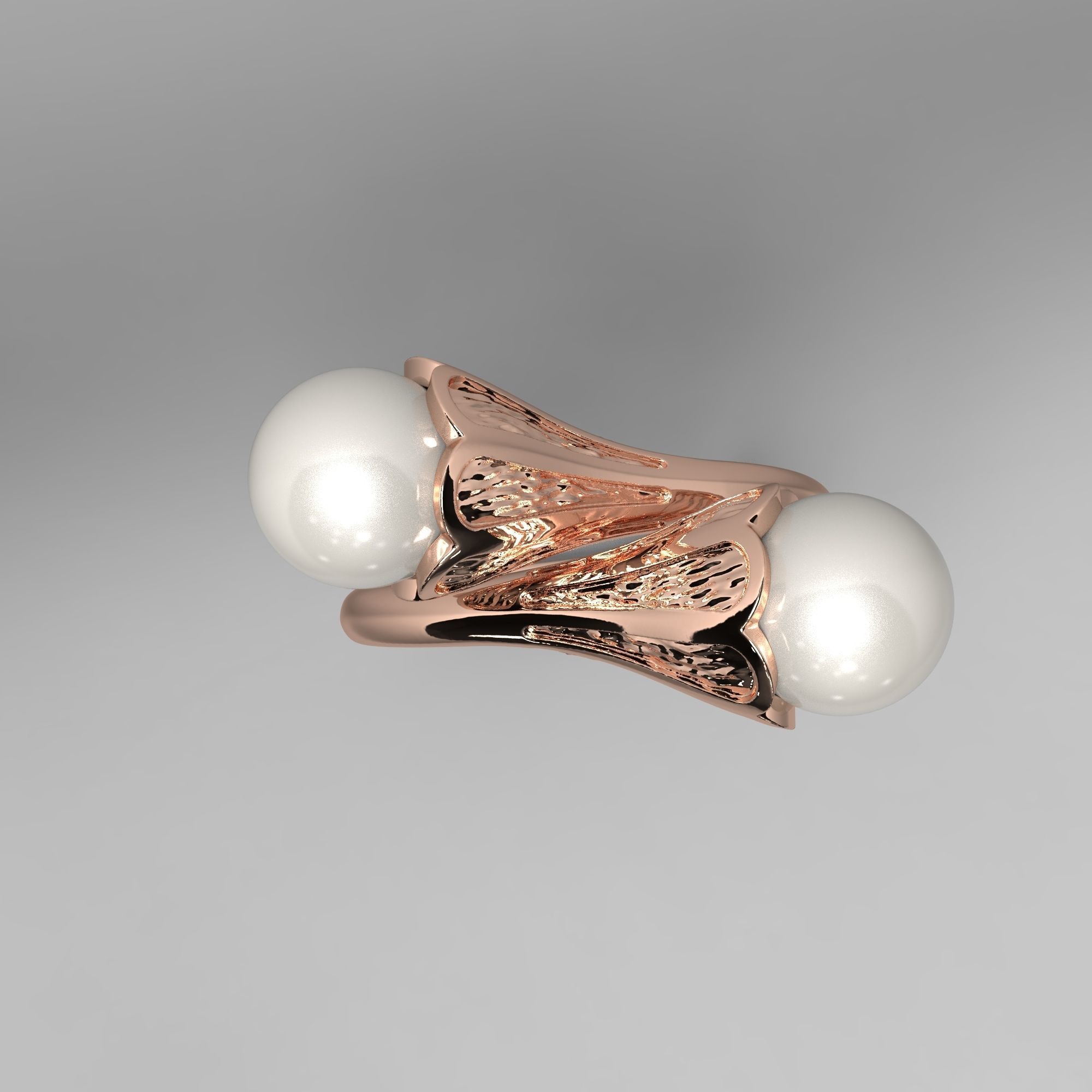 A sophisticated silver ring with two cross-set pearls and intricate detailing.