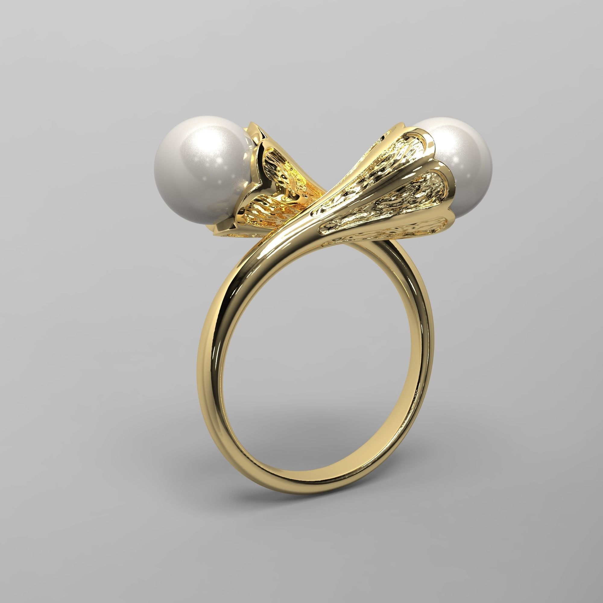 A sophisticated silver ring with two cross-set pearls and intricate detailing.