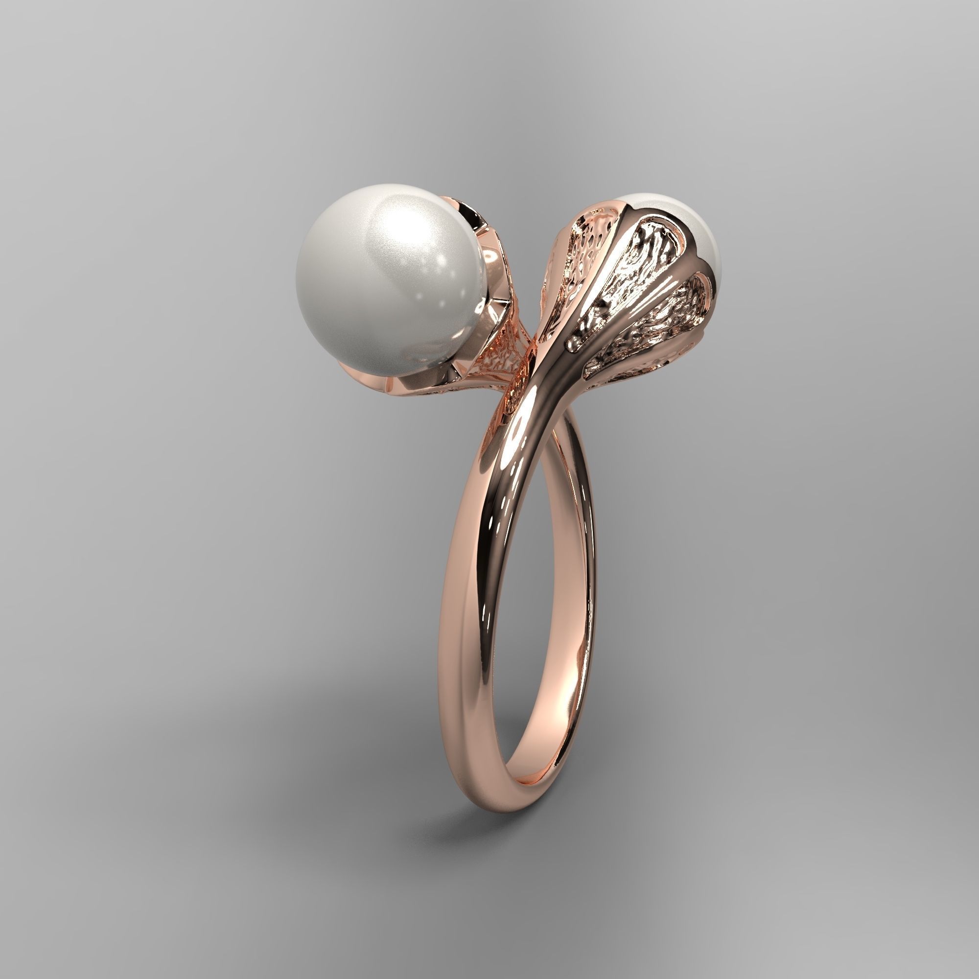 A sophisticated silver ring with two cross-set pearls and intricate detailing.
