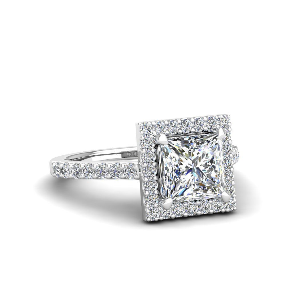 A stunning Silver 925 ring featuring a princess cut stone surrounded by a radiant halo.
