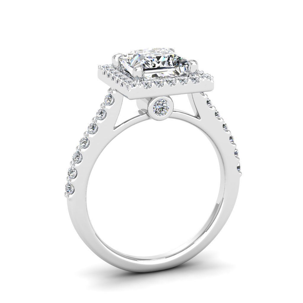 A stunning Silver 925 ring featuring a princess cut stone surrounded by a radiant halo.