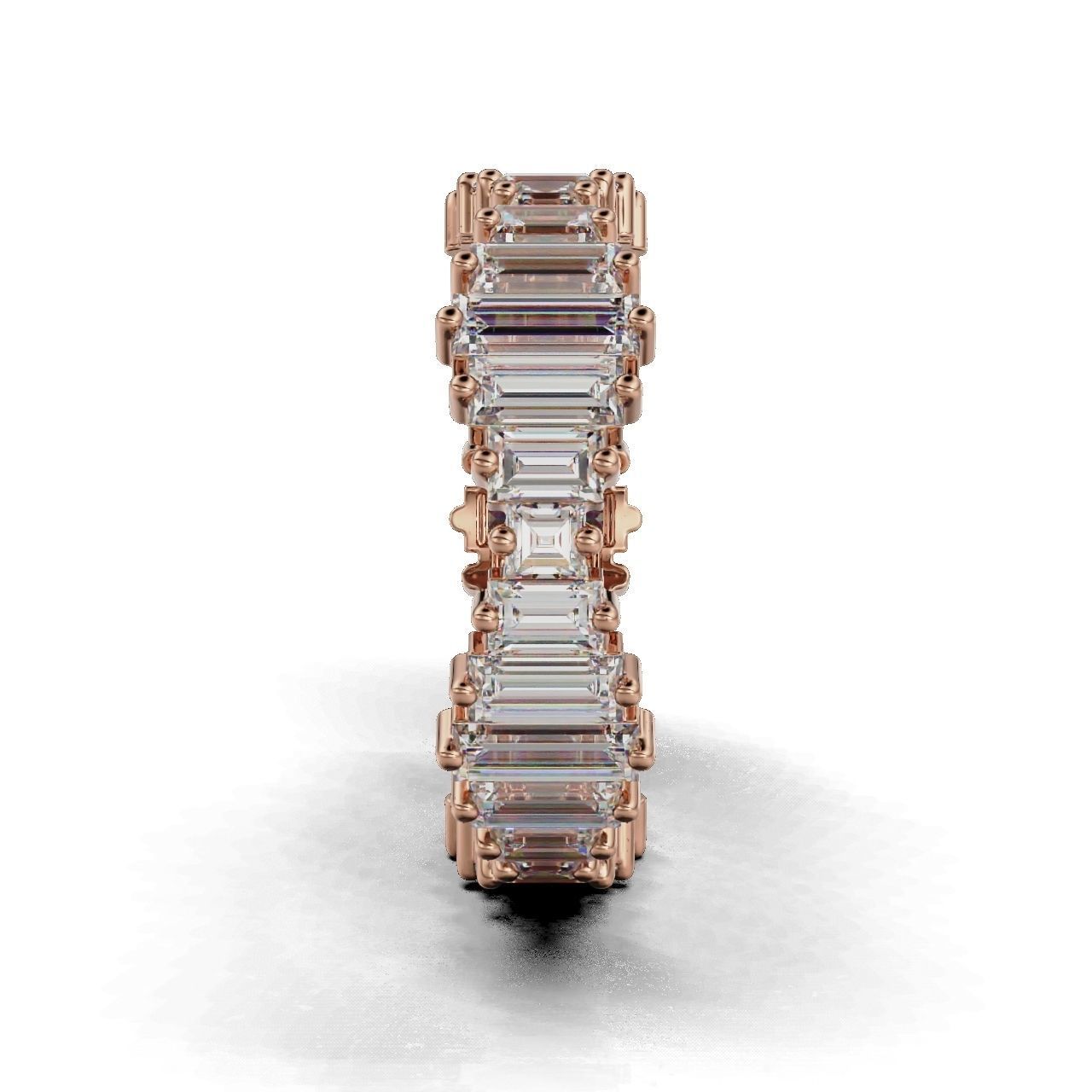 Elegant silver ring with baguette-cut stones in a continuous band.