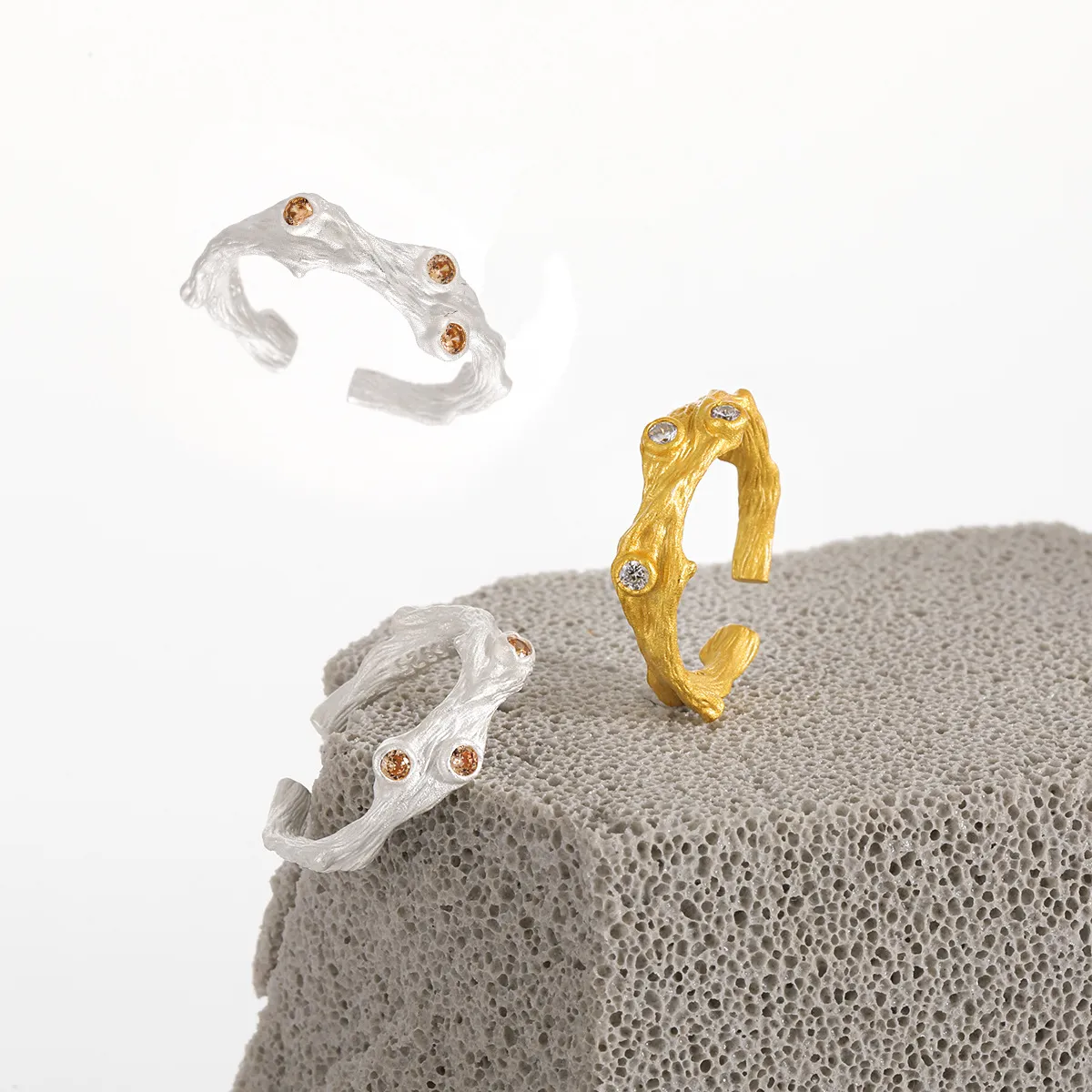 Rustic branch-inspired silver ring with sparkling zircon stones.