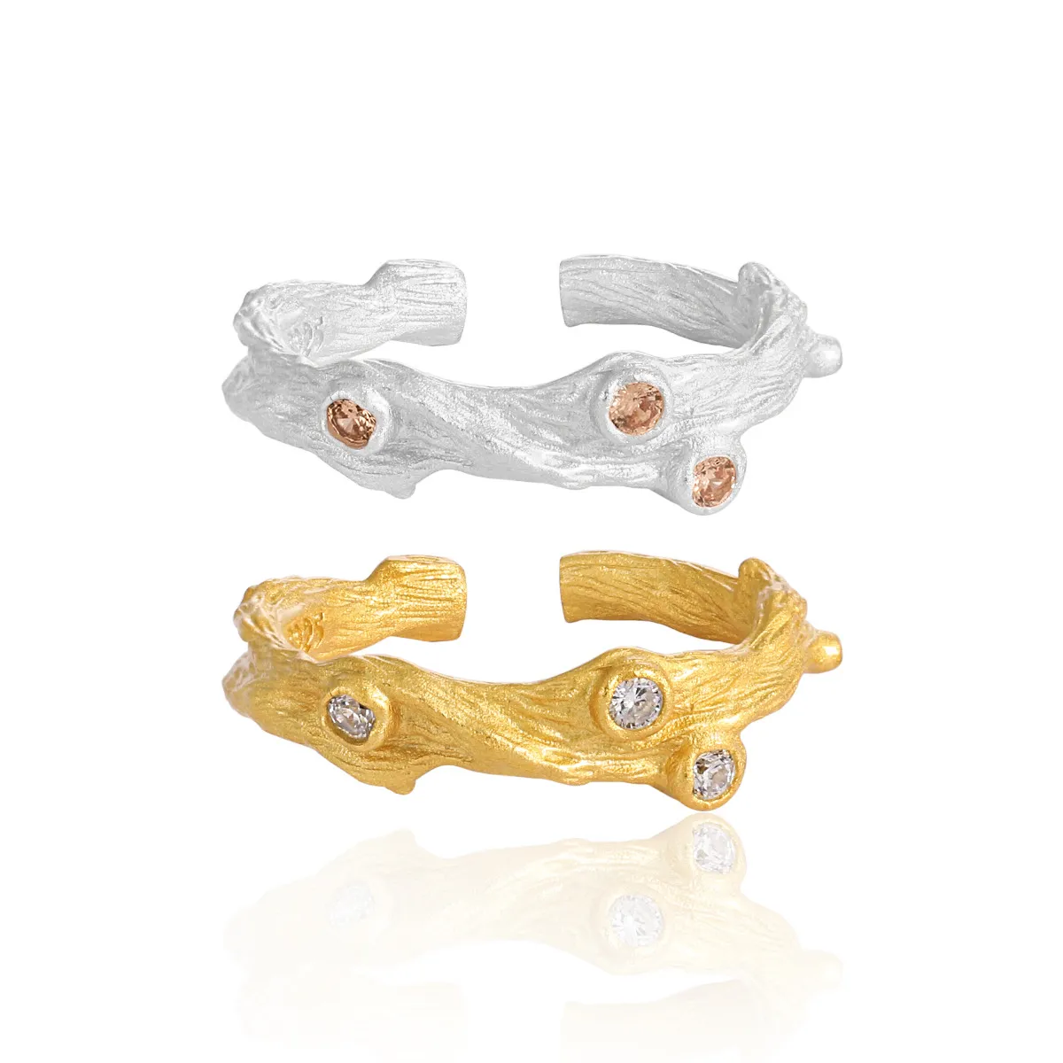 Rustic branch-inspired silver ring with sparkling zircon stones.