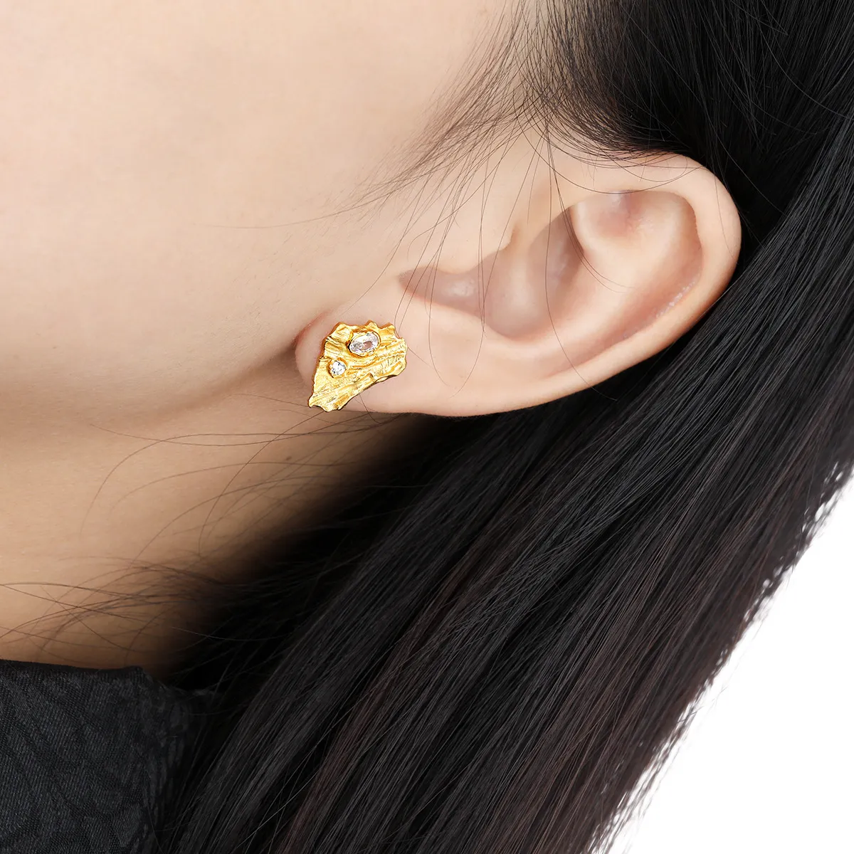 Crystalline textured stud earrings in gold and silver with sparkling crystals.