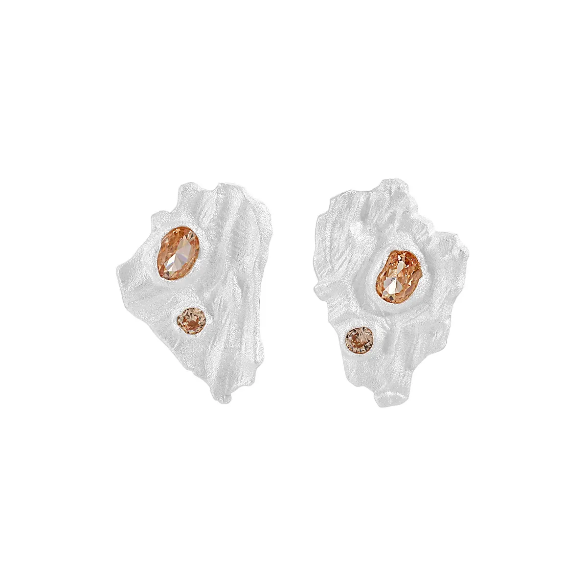 Crystalline textured stud earrings in gold and silver with sparkling crystals.